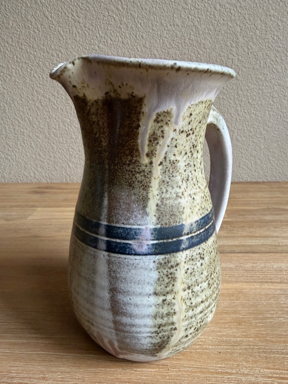 Handcrafted Speckled Ceramic Pitcher in Beige with Blue Stripe - Picture 4 of 13